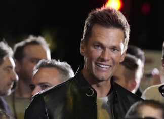 
			
				                                NFL quarterback Tom Brady, a cast member and producer of “80 for Brady,” looks down the carpet at the premiere of the film, Tuesday, Jan. 31, 2023, at the Regency Village Theatre in Los Angeles.
                                 AP Photo | Chris Pizzello

			
		